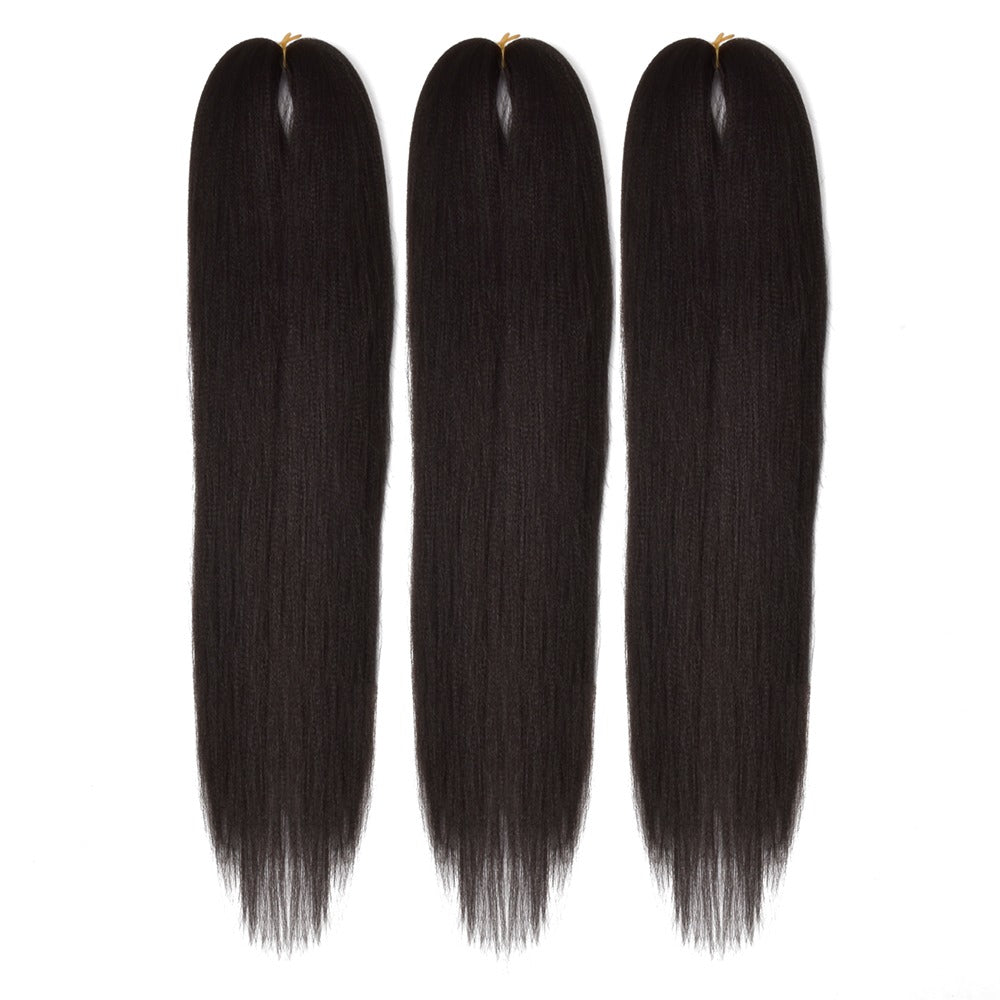 Three bundles of 28" hair in black, laying on a white field in natural state.