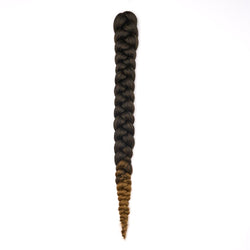 A length of braided hair in ombré brown on a white field.